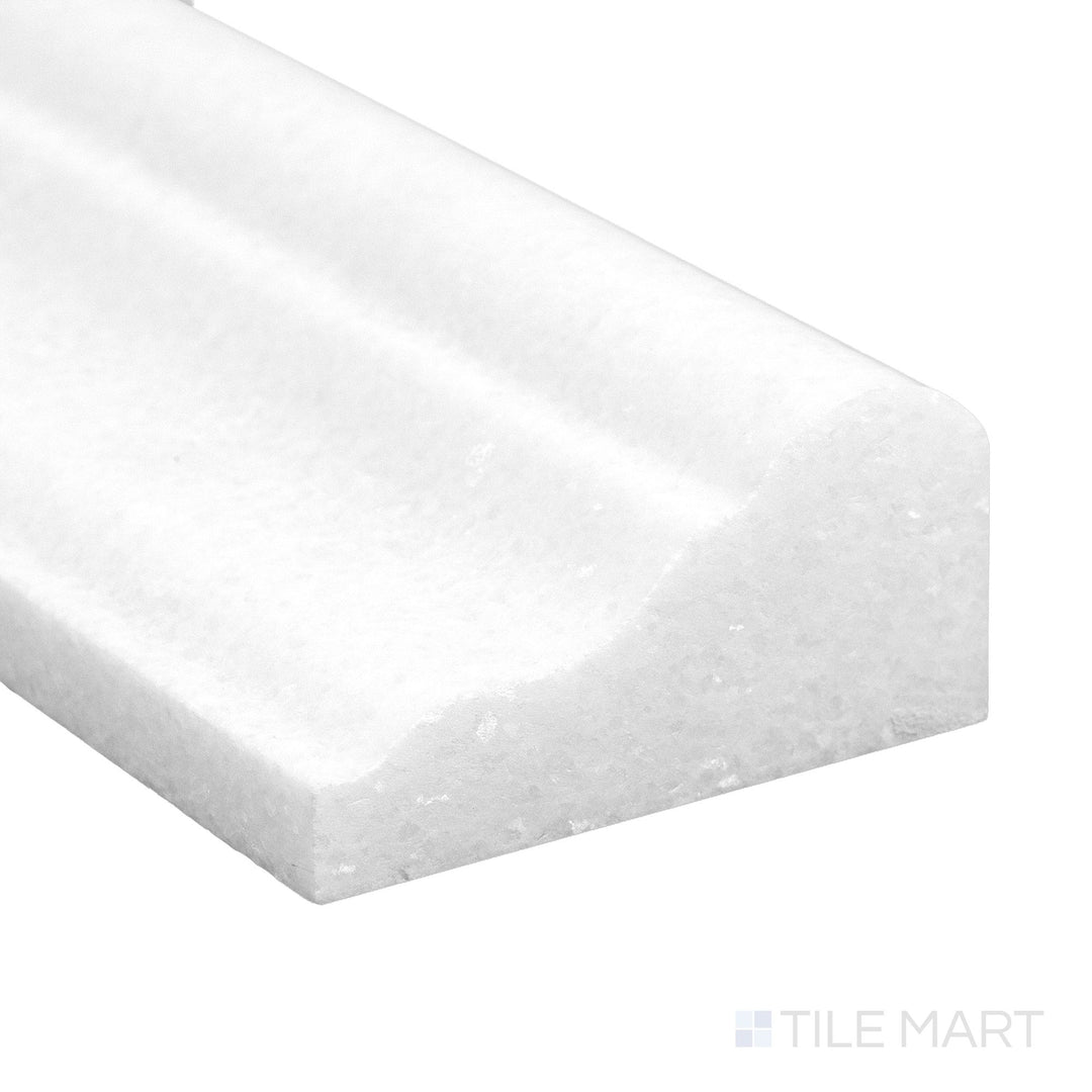 A refined corner view of Thassos White Marble 2x12 honed grand chair rail showing soft matte surface and pure tone.