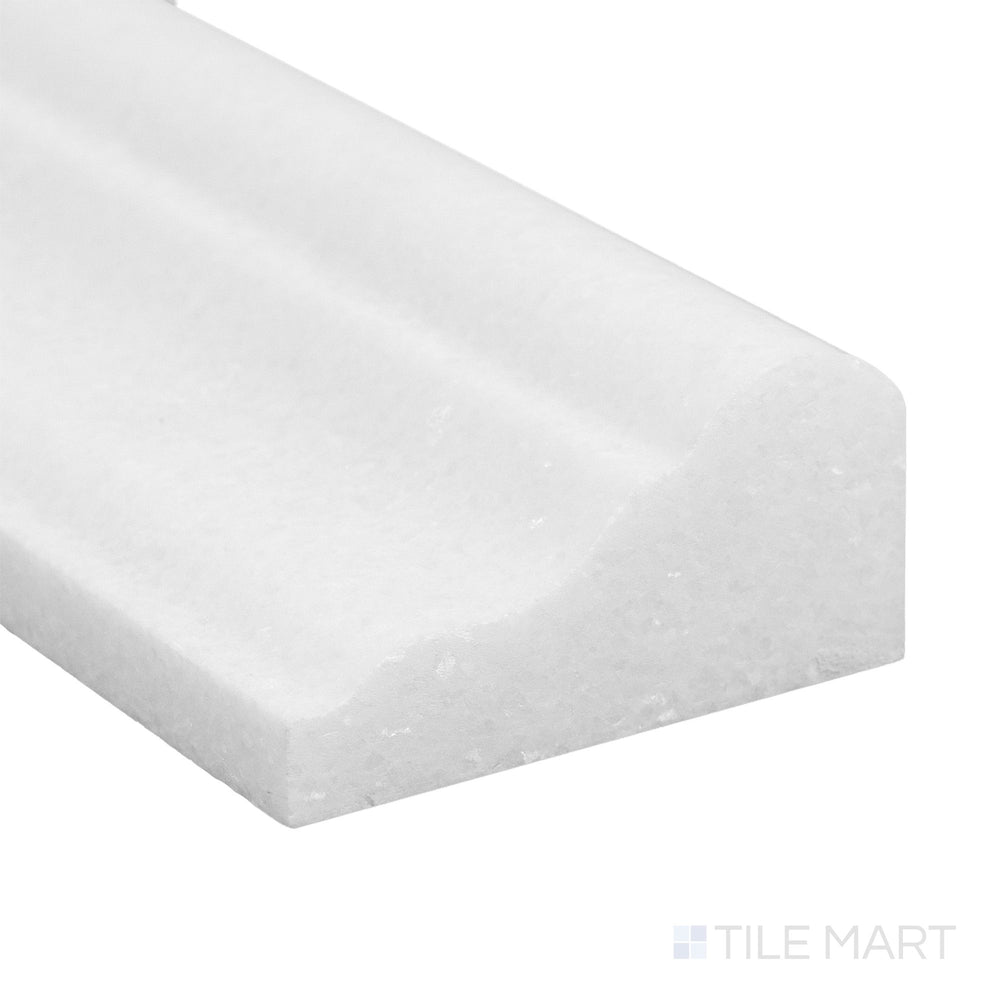 Polished to perfection, the Thassos White Marble 2x12 grand chair rail corner displays radiant brightness and smooth finish.