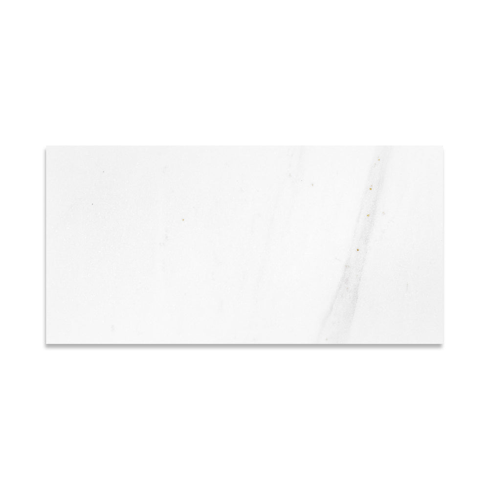 Overhead view of Thassos White Marble 12x24 tile in honed finish, featuring expansive layout with smooth white marble ideal for modern interiors.