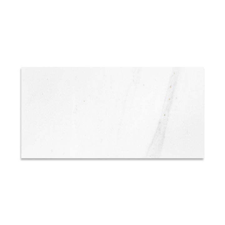 Overhead view of Thassos White Marble 12x24 tile in honed finish, featuring expansive layout with smooth white marble ideal for modern interiors.