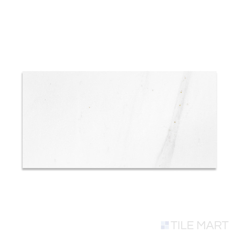Flat-lay of Thassos White Marble 12x24 polished tile, a large format white marble slab with a reflective polished finish.