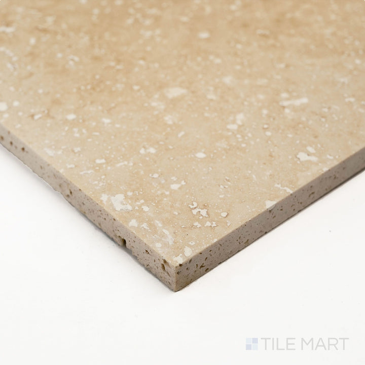 A detailed corner shot of Ivory Premium Travertine 3x6 filled and honed tile showing smooth matte texture and warm tone.