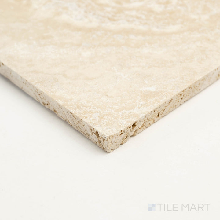 Weathered at the edges, the Ivory Premium Travertine 3x6 tumbled tile highlights rustic character and soft ivory hue.