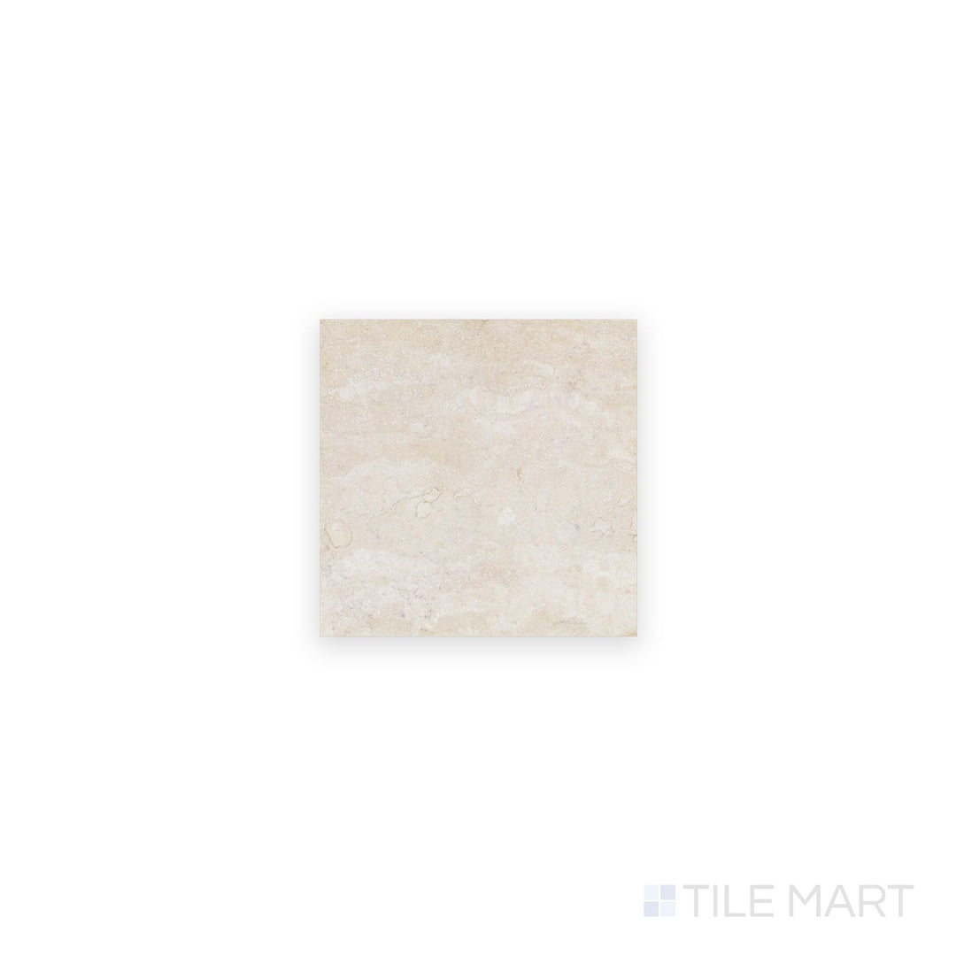 Ivory Premium Travertine 4x4 filled and honed tile viewed from above, showcasing a smooth matte surface with warm neutral color and refined texture.