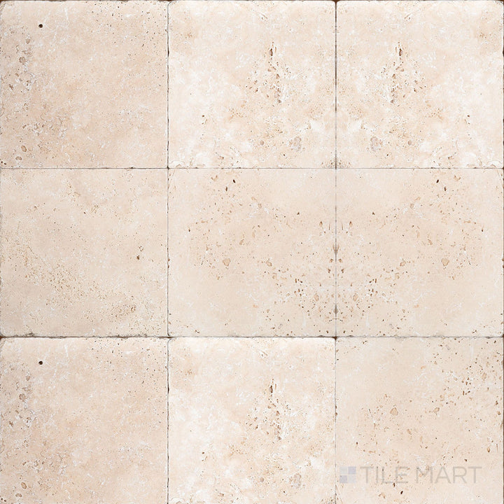 Full view of Ivory Premium Travertine 6x6 Tumbled Tile presenting square stone tiles with warm tones and an earthy, tumbled appearance.