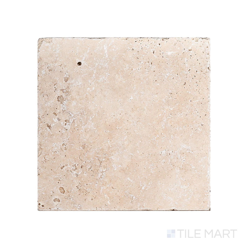 Top-down view of Ivory Premium Travertine 16x16 tile in tumbled finish, featuring a rustic surface with warm beige tones and weathered edges.