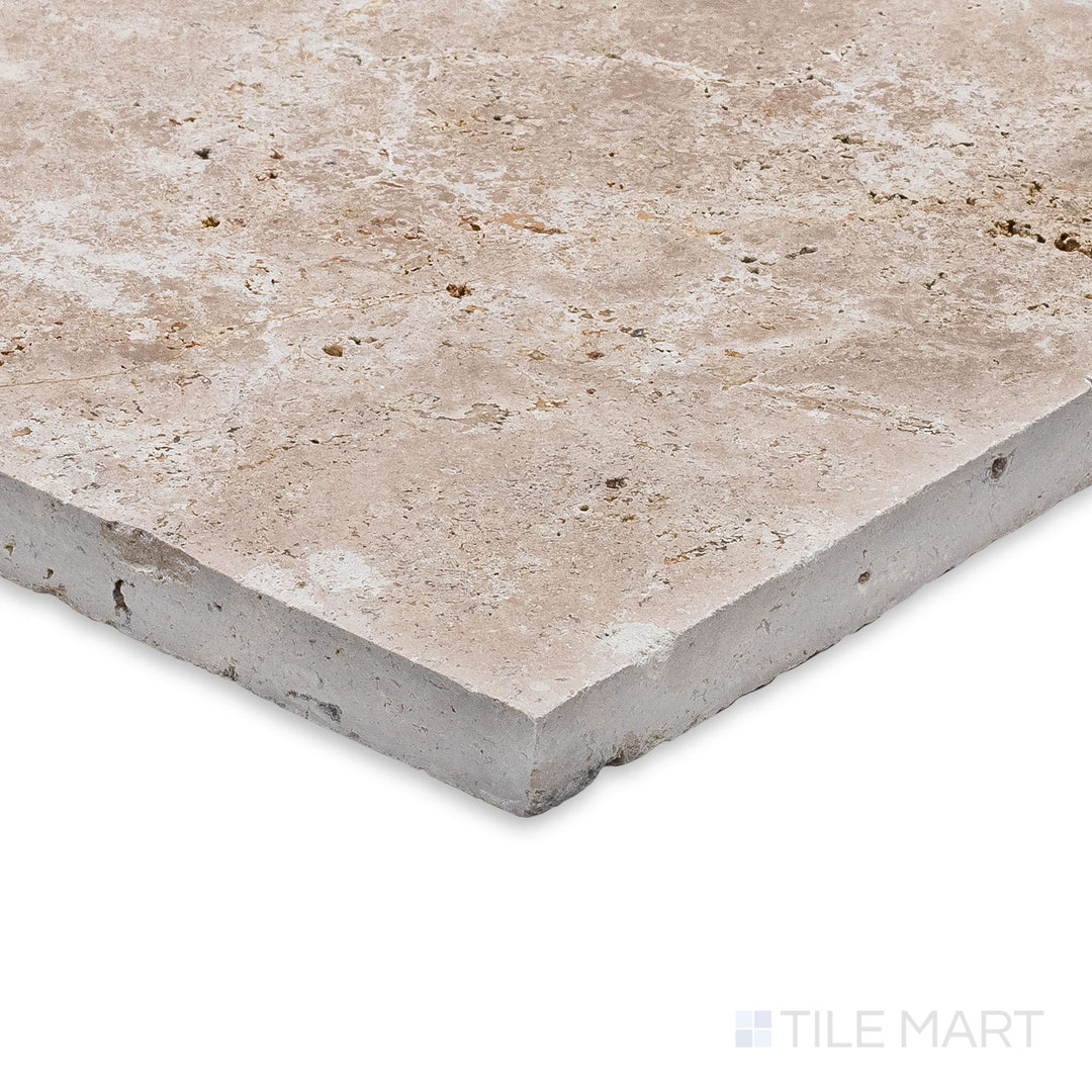 Ivory Premium Travertine Versailles Pattern Brushed and Chiseled Tile set seen at a corner angle, emphasizing its textured surface and multi-size format for rustic elegance.