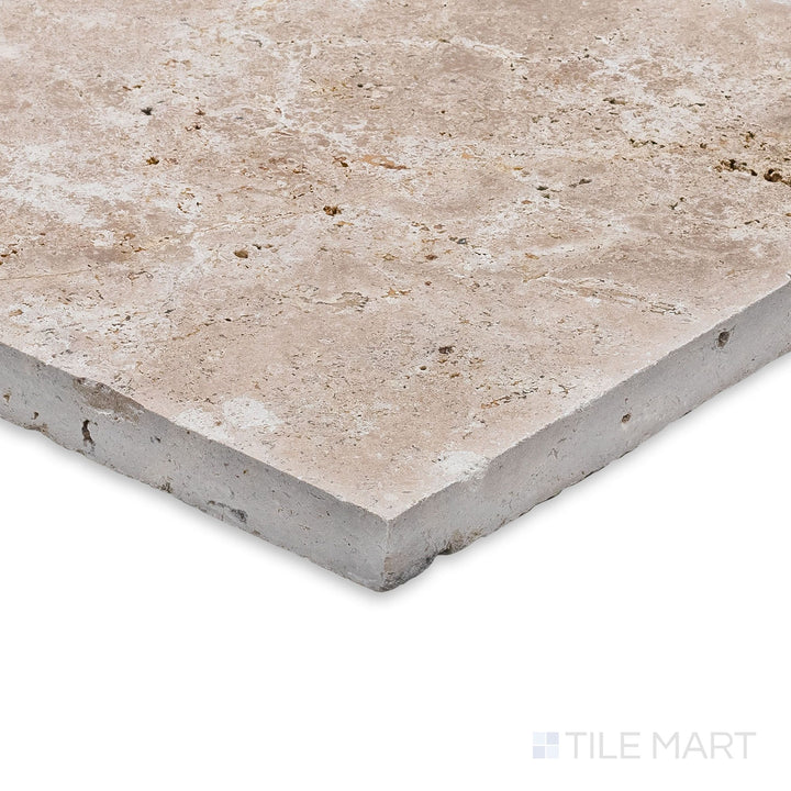 Ivory Premium Travertine Versailles Pattern Brushed and Chiseled Tile set seen at a corner angle, emphasizing its textured surface and multi-size format for rustic elegance.
