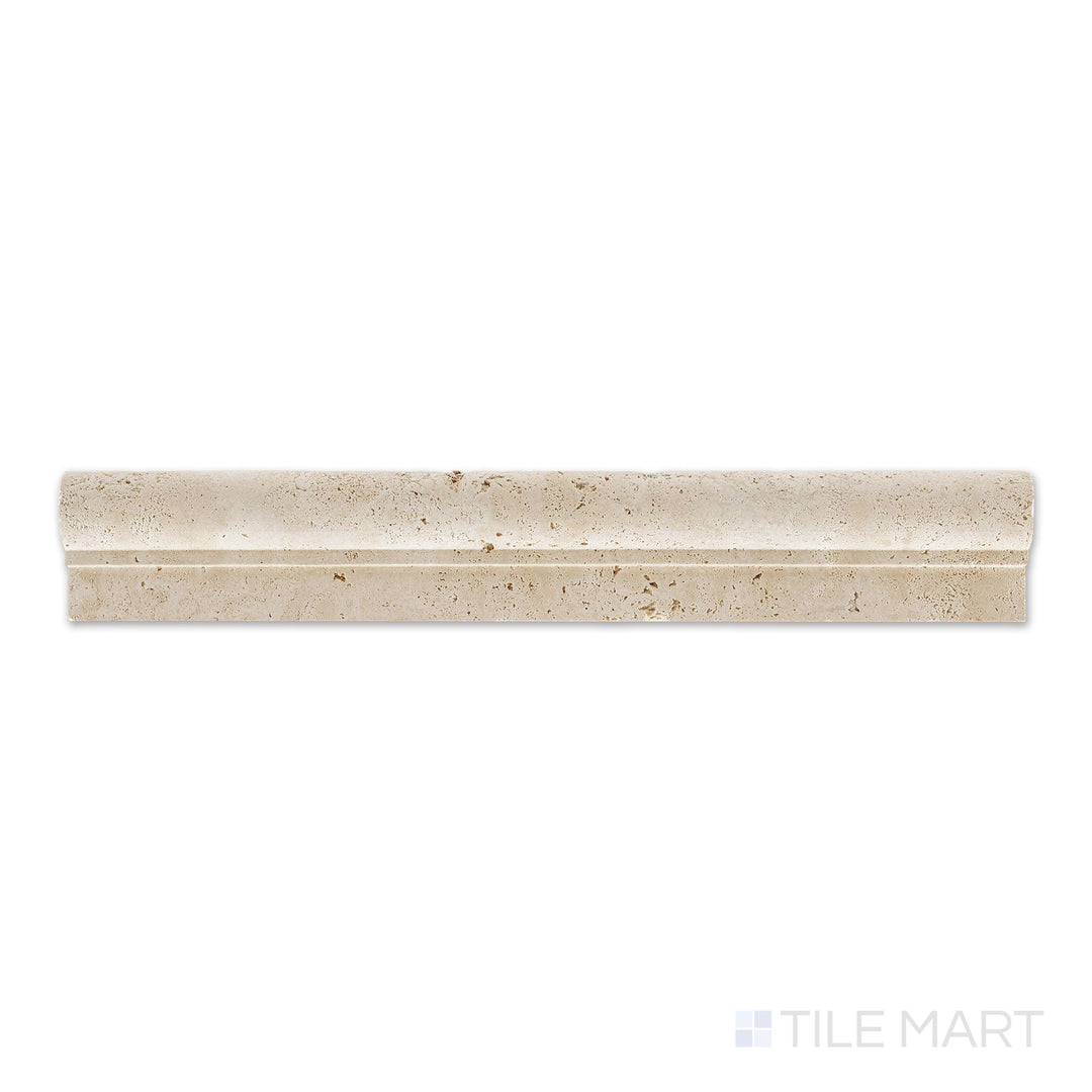 Flat-lay view of Ivory Premium Travertine 2x12 honed classic chair rail, featuring a rounded profile and honed beige surface with a refined look.