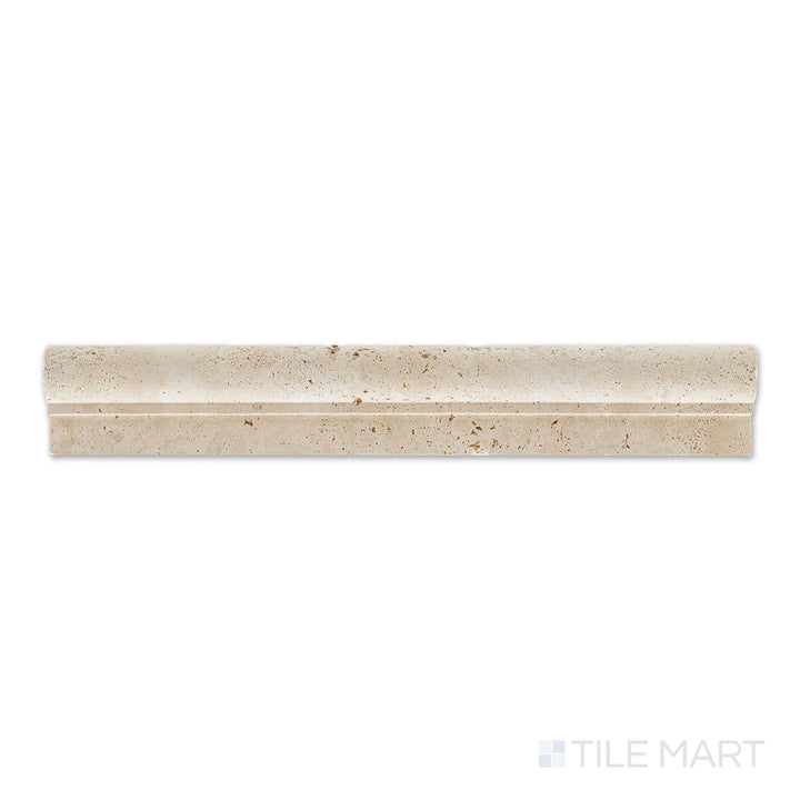 Flat-lay view of Ivory Premium Travertine 2x12 honed classic chair rail, featuring a rounded profile and honed beige surface with a refined look.