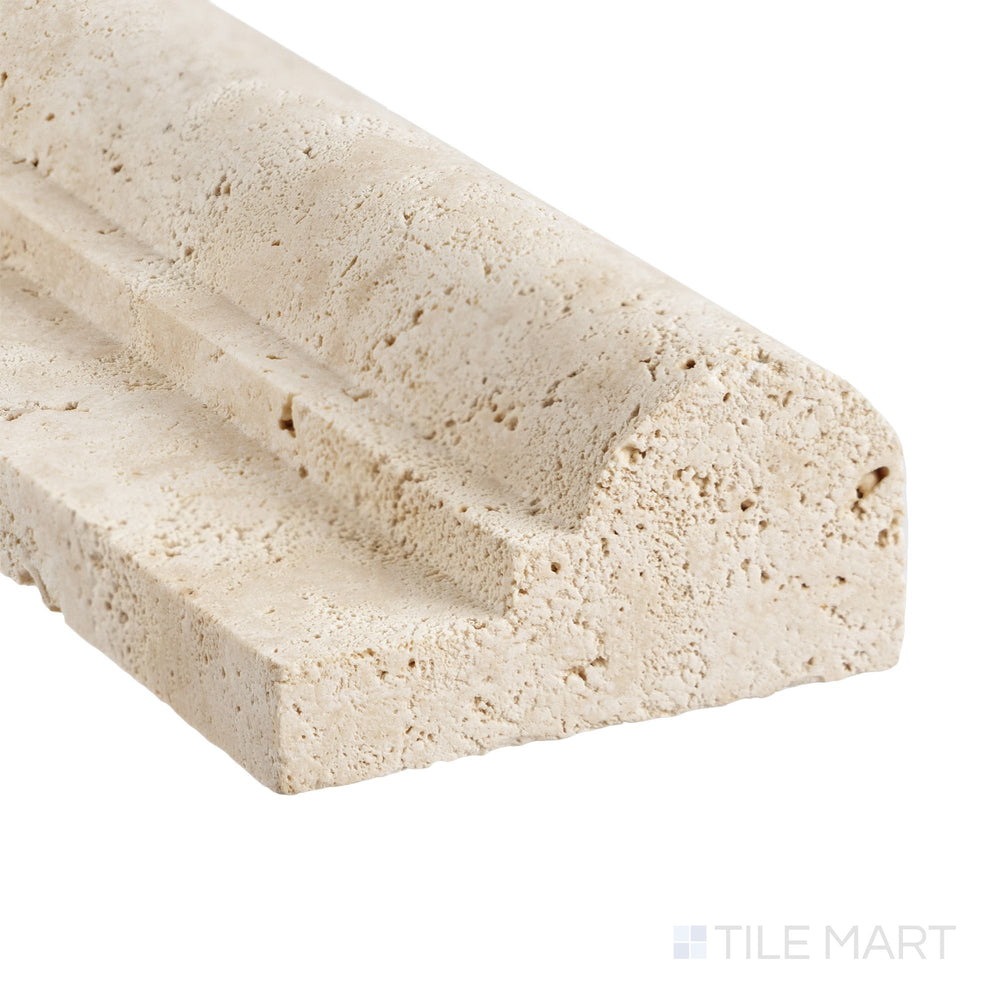 At the edge, the Ivory Premium Travertine 2x12 honed classic chair rail shows refined texture and timeless natural warmth.