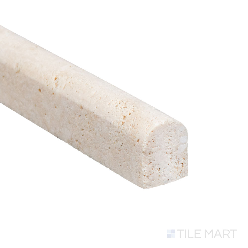 A close corner of Ivory Premium Travertine 0.5x12 honed mini liner revealing soft edges and subtle stone pattern.