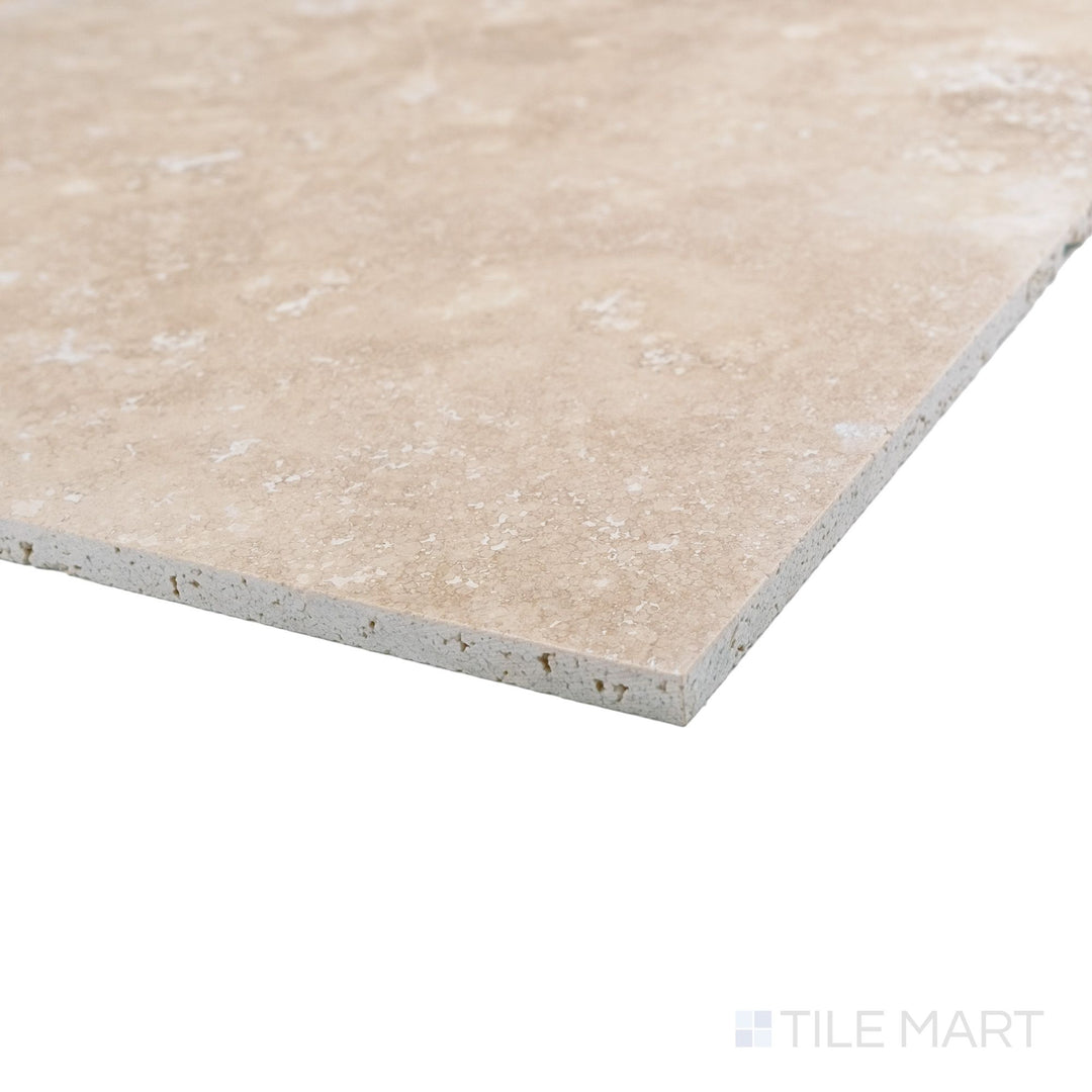 Vera Cruz travertine 12x12 tile shown at corner with filled and honed surface and warm natural tones