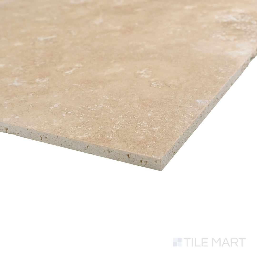 Vera Cruz travertine 16x16 tile in corner view with filled and honed surface and subtle tonal variation