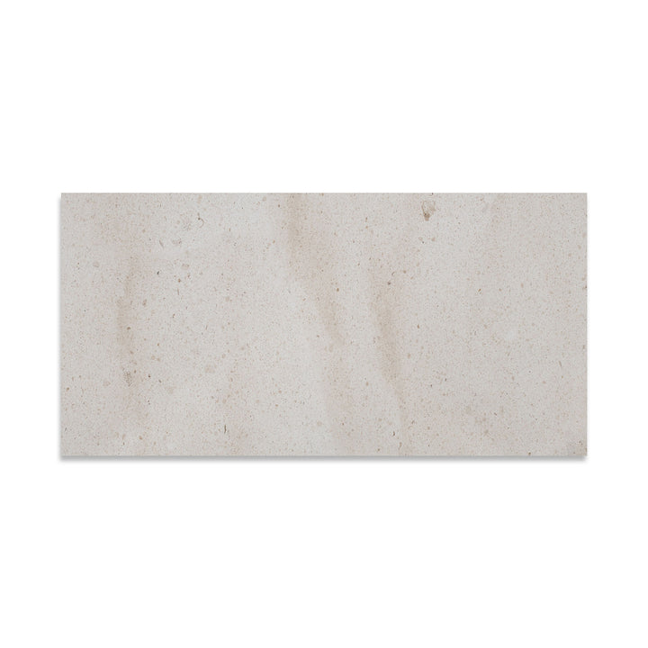 Crema Europa Limestone 12x24 tile in honed finish viewed from above, showcasing light beige color with fine natural movement and a smooth matte surface.