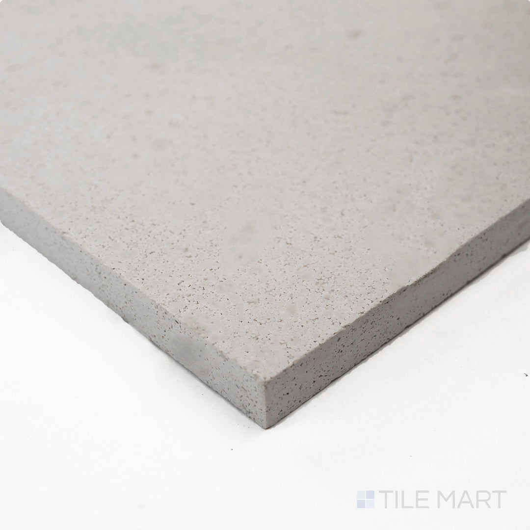 Seen from the corner, the Crema Europa Limestone 18x18 honed tile captures elegant matte finish and soft beige tone.