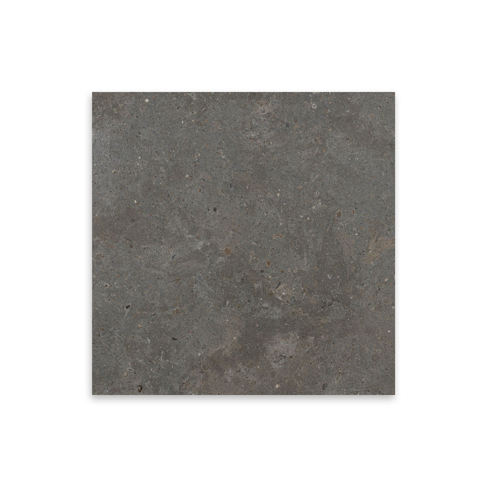 Top-down view of Lagos Blue Limestone 12x12 tile in honed finish, featuring smooth texture and deep grey-blue tones with a refined matte surface.