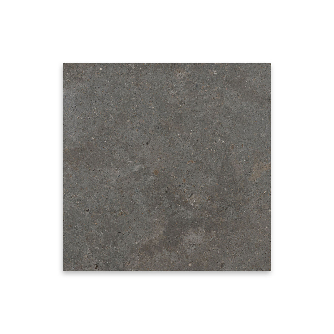 Top-down view of Lagos Blue Limestone 12x12 tile in honed finish, featuring smooth texture and deep grey-blue tones with a refined matte surface.