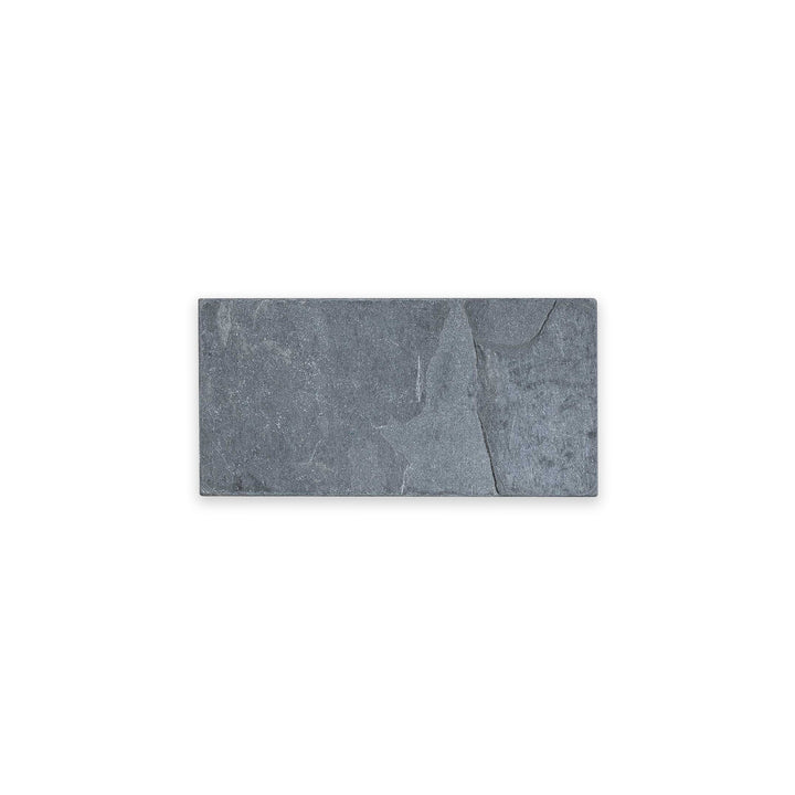 Indian Black Slate 3x6 tile in tumbled finish viewed from above, featuring soft edges and a rustic matte texture in a deep charcoal tone.