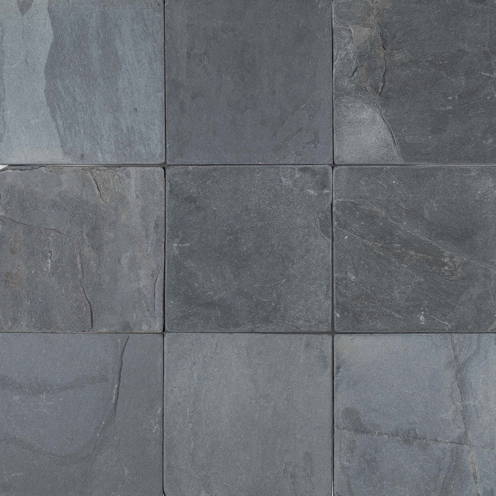 Overview of Indian Black Slate 6x6 Tumbled Tile displaying a timeworn matte finish and consistent dark tones in square format.