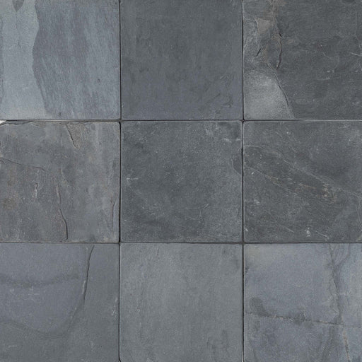Overview of Indian Black Slate 6x6 Tumbled Tile displaying a timeworn matte finish and consistent dark tones in square format.