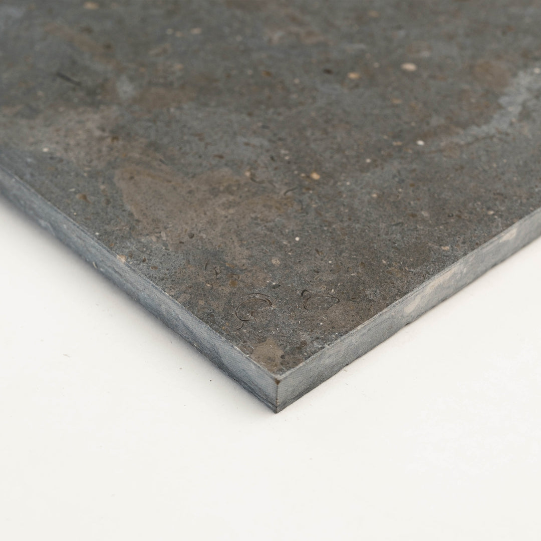 Indian Black Slate Versailles Pattern Gauged Tile shown from the corner, capturing the elegant multi-size layout and textured slate finish for statement floors.