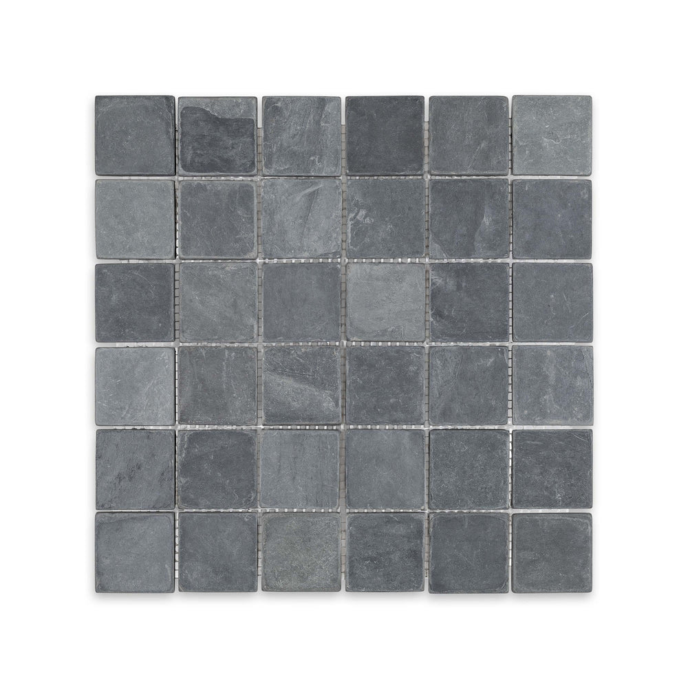 Top-down view of Indian Black Slate 2 inch square mosaic in tumbled finish, highlighting rugged texture and deep black tones in a classic grid layout.