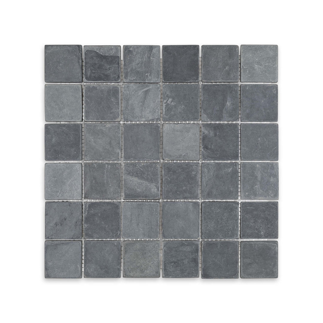 Top-down view of Indian Black Slate 2 inch square mosaic in tumbled finish, highlighting rugged texture and deep black tones in a classic grid layout.