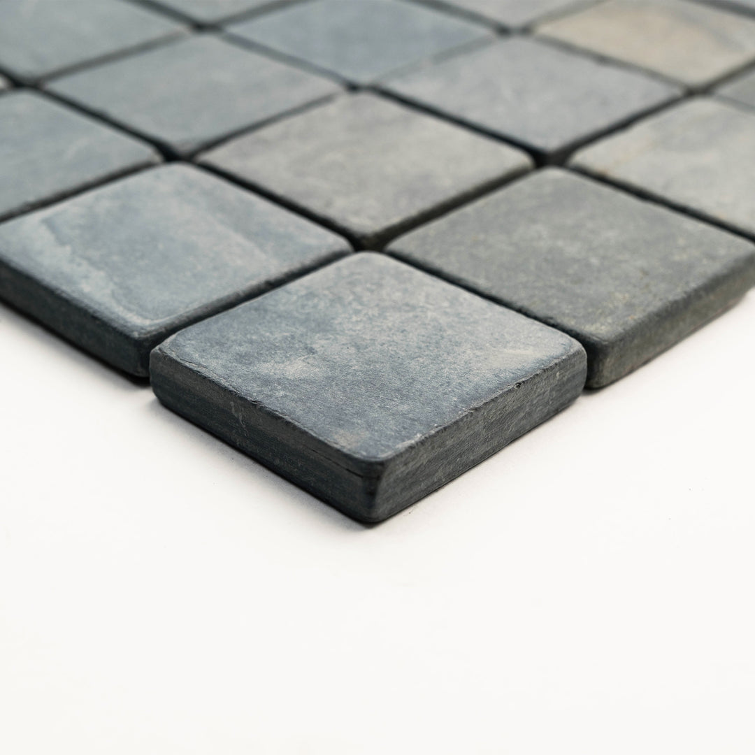 Corner view of Indian Black Slate 2-Inch Square Tumbled Mosaic Tile, featuring small-scale slate pieces with a raw, natural finish ideal for rustic mosaics.
