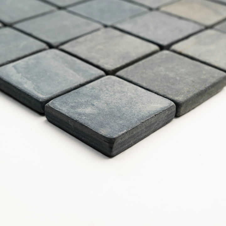 Corner view of Indian Black Slate 2-Inch Square Tumbled Mosaic Tile, featuring small-scale slate pieces with a raw, natural finish ideal for rustic mosaics.