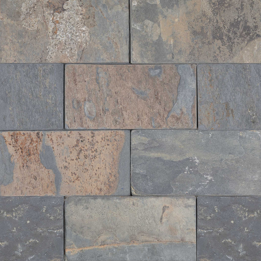 Overview of California Gold Slate 3x6 Tumbled Tile showing multicolor earth tones in a rustic subway layout with naturally textured surface.