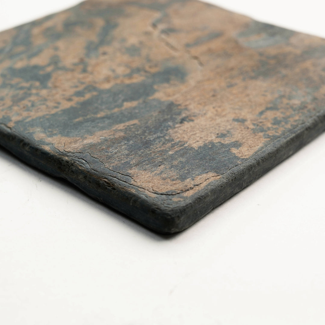 Angled view of California Gold Slate 4x4 Tumbled Tile, featuring golden-brown hues and a naturally distressed surface ideal for traditional or earthy interiors.