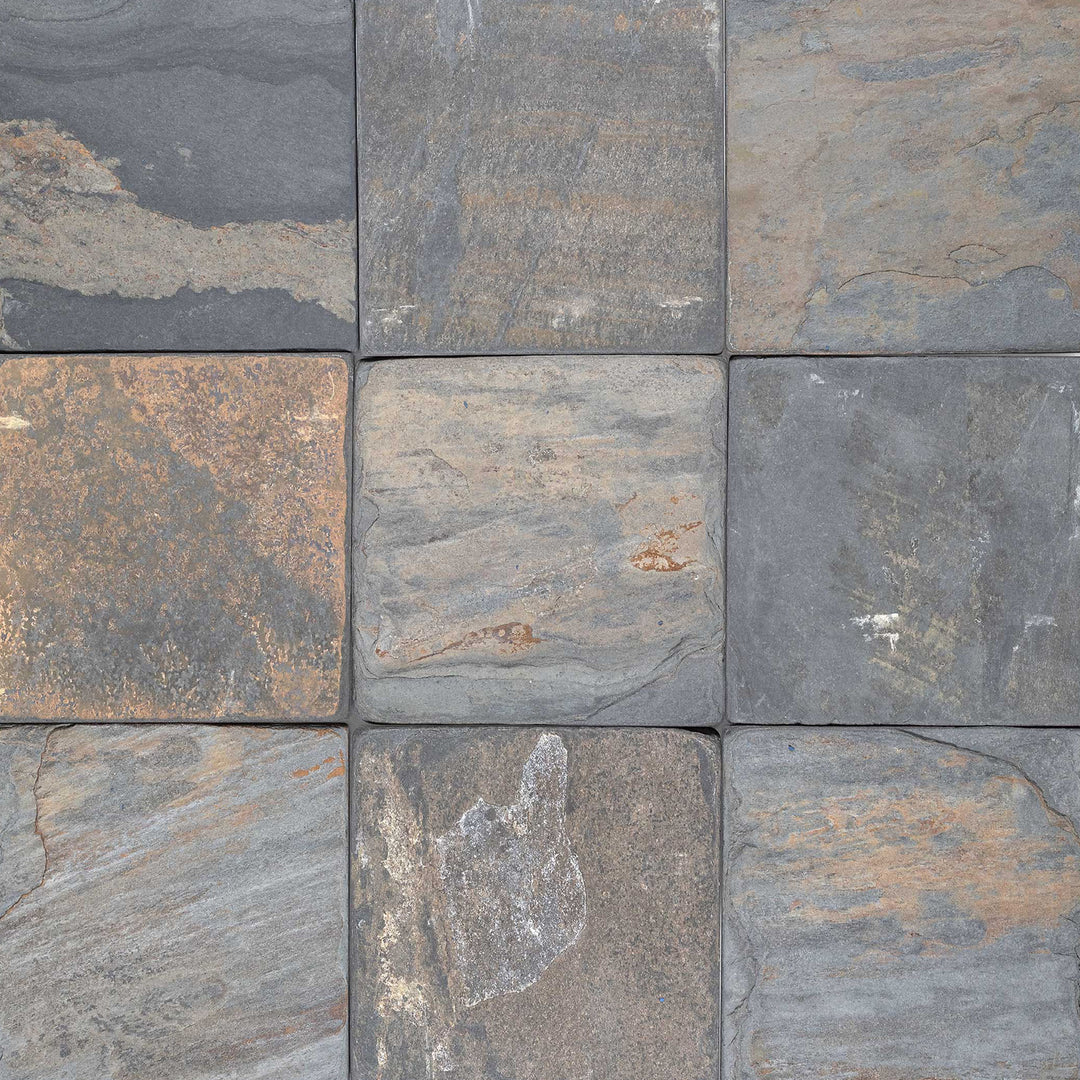 Clean view of California Gold Slate 6x6 Tumbled Tile showcasing varied coloration and a rough, aged texture for natural appeal.