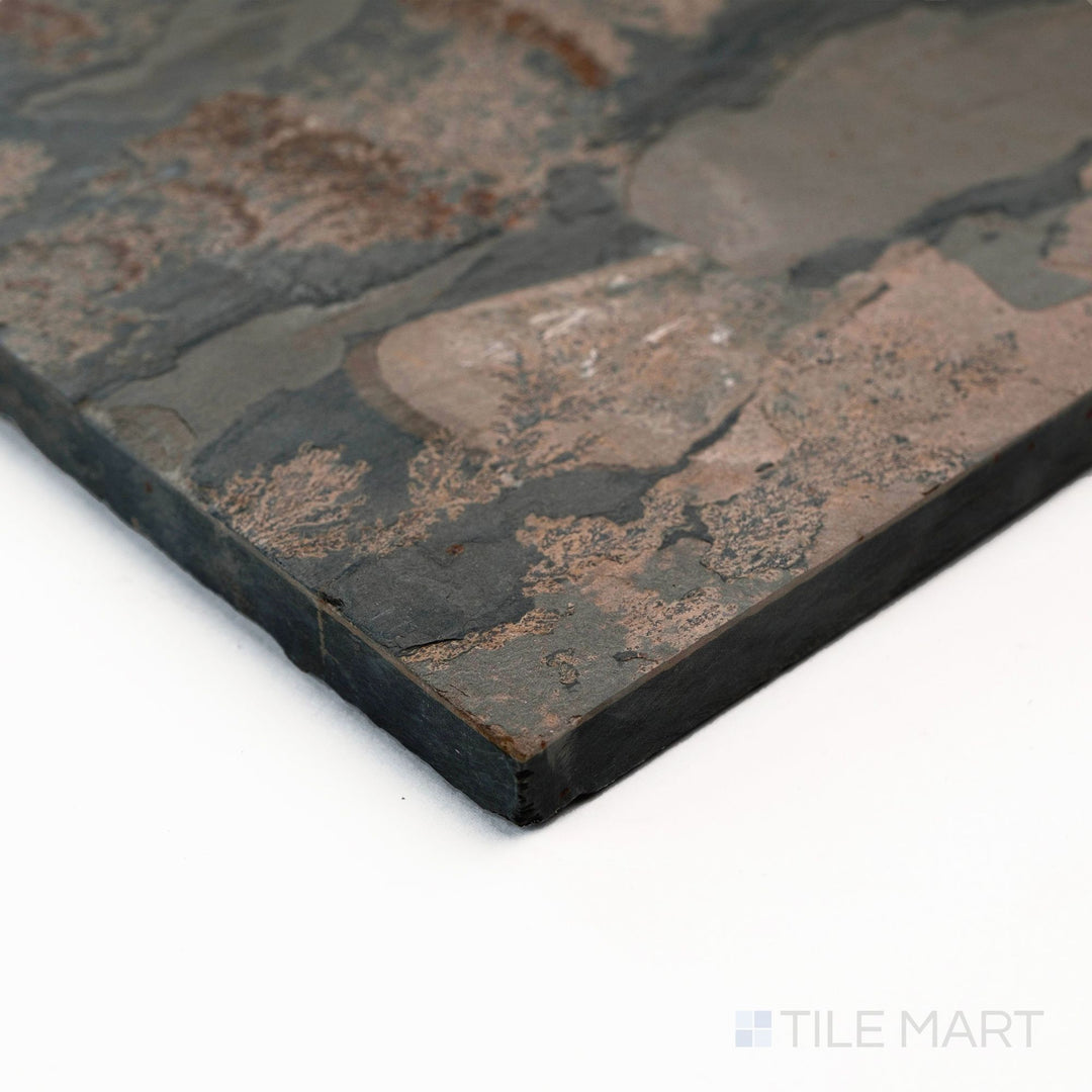 Corner close-up of California Gold Slate Versailles pattern gauged tile revealing rustic surface and warm earth hues.