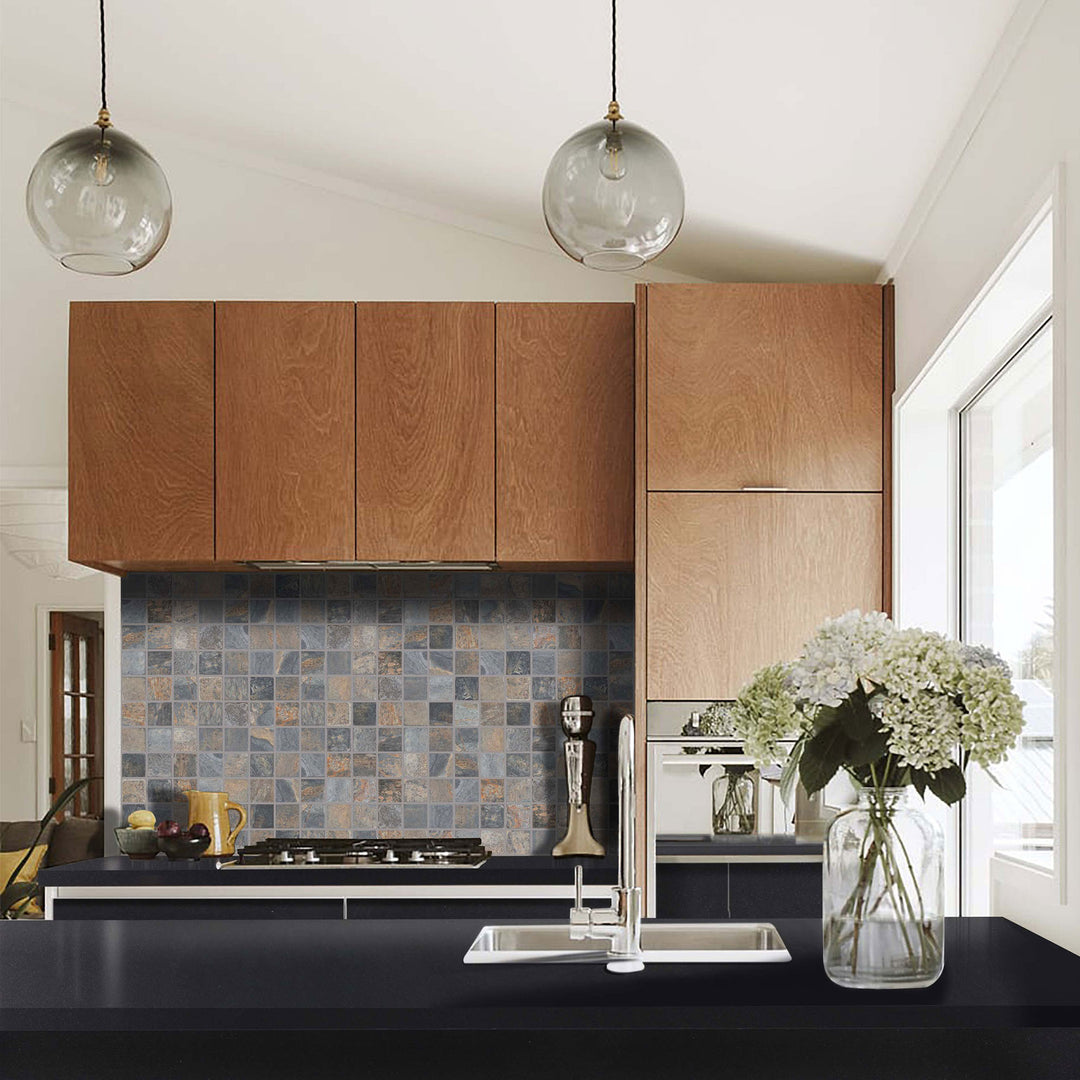 Modern kitchen with wooden cabinets, tiled backsplash, and a vase of flowers on the counter.