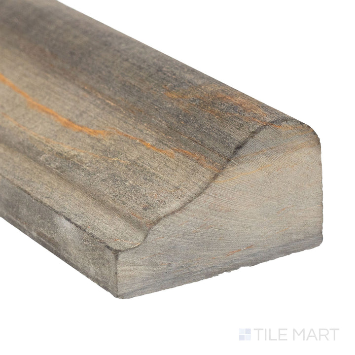 A refined corner angle of California Gold Slate 2x12 honed standard chair rail emphasizing natural veining and texture.