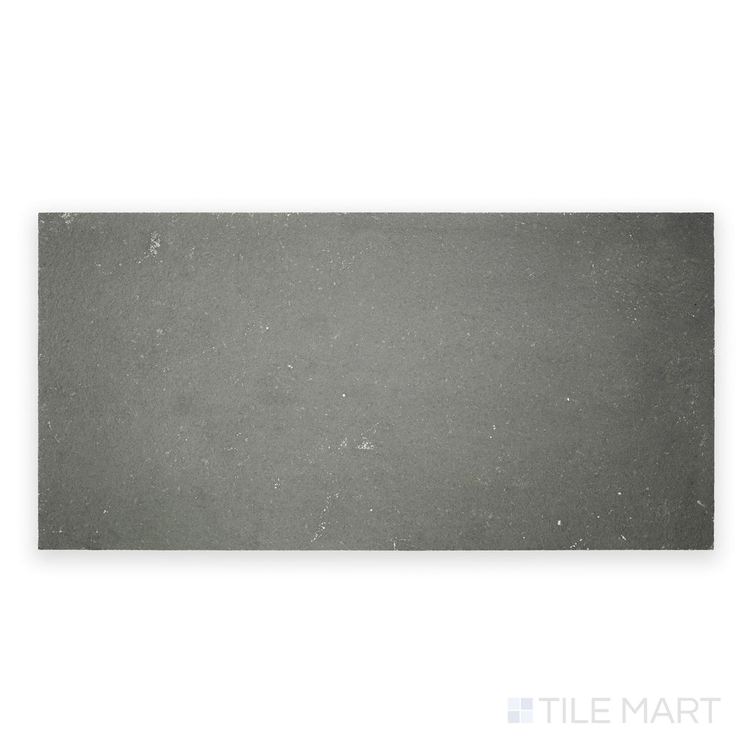 Top-down view of Indian Bluestone Slate 12x24 tile in gauged finish, featuring deep bluish-gray tones and a flat surface with natural stone character.