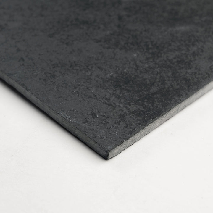 Brazilian Black Slate 12x12 Gauged Tile shown from a corner perspective, featuring a consistent black tone and smooth finish ideal for timeless floor or wall use.