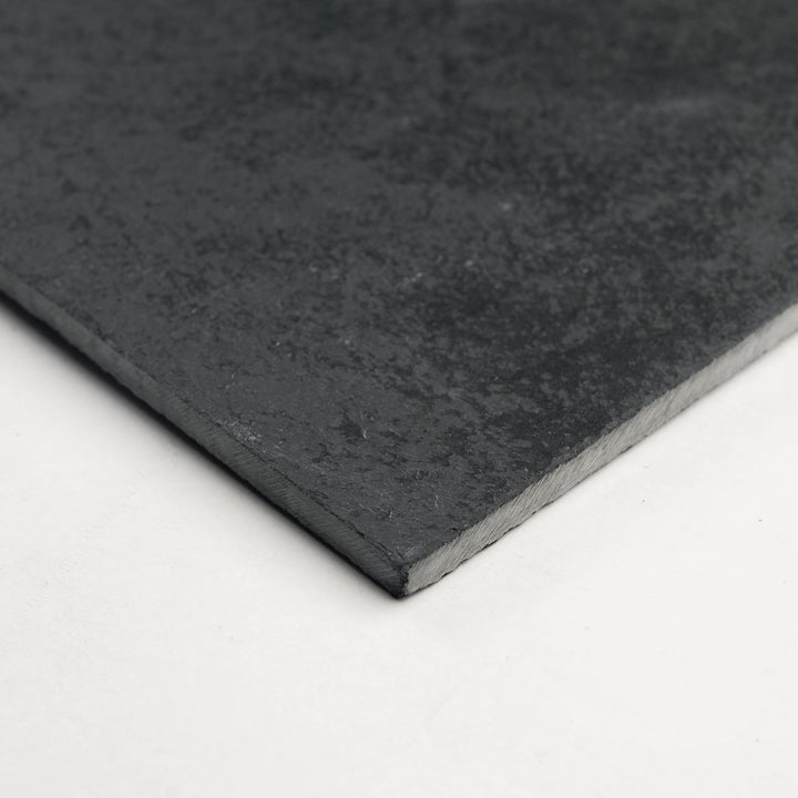 Brazilian Black Slate 24x24 Gauged Tile photographed from a corner, revealing its expansive form and classic slate texture suited for high-impact spaces.