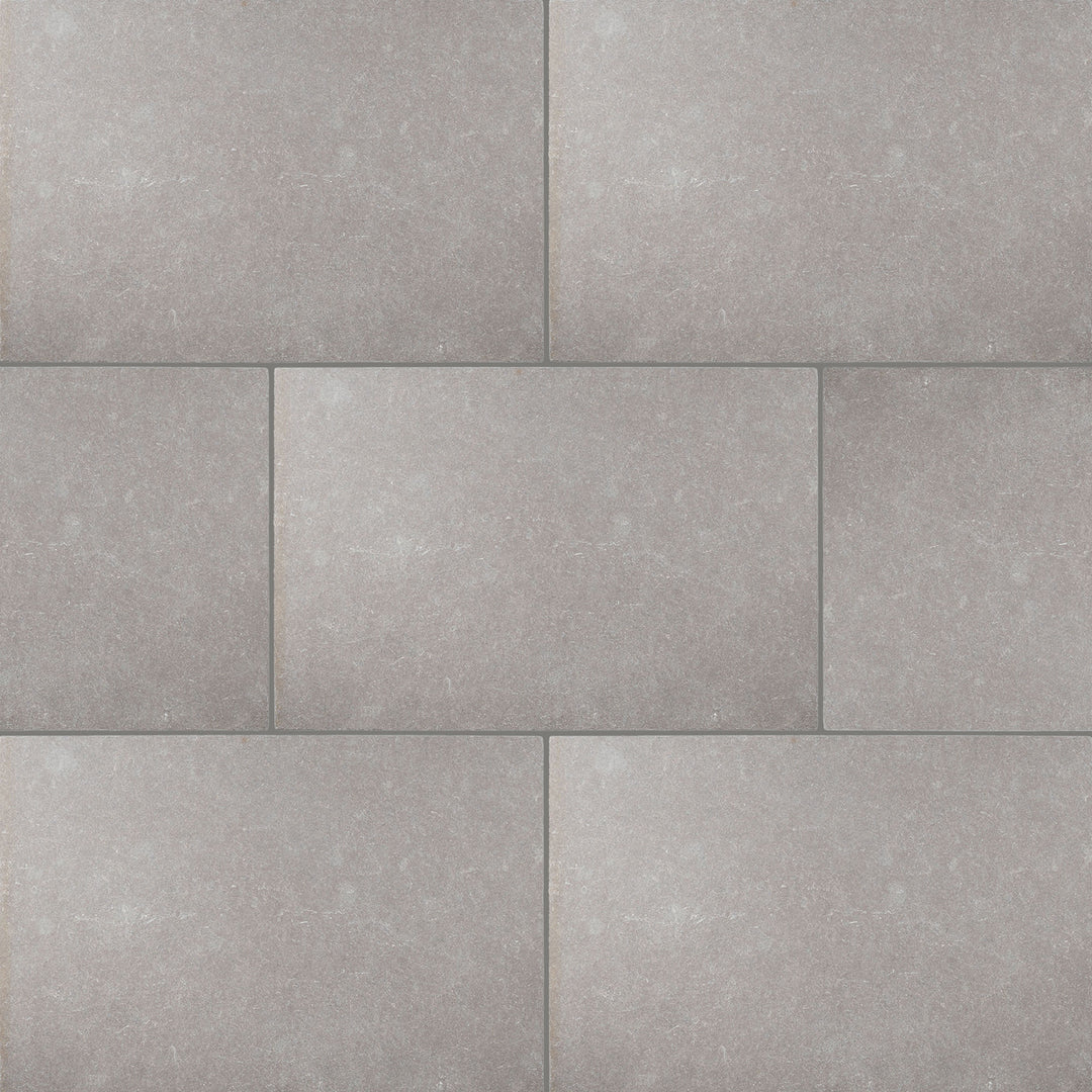 Full view of Limestone Purbeck Grey 16x24 Distressed Paver displaying aged texture and natural variation in warm grey tones.