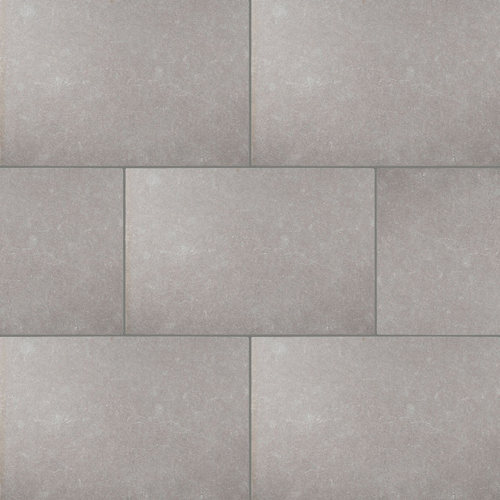 Full view of Limestone Purbeck Grey 16x24 Distressed Paver displaying aged texture and natural variation in warm grey tones.