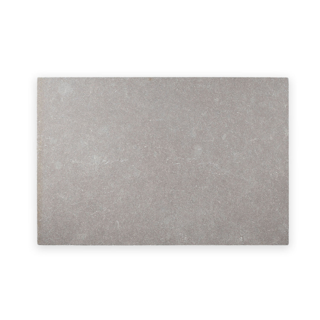 Limestone Purbeck Grey 16x24 distressed paver seen from above, offering a weathered surface with soft gray tones and an aged, natural finish.