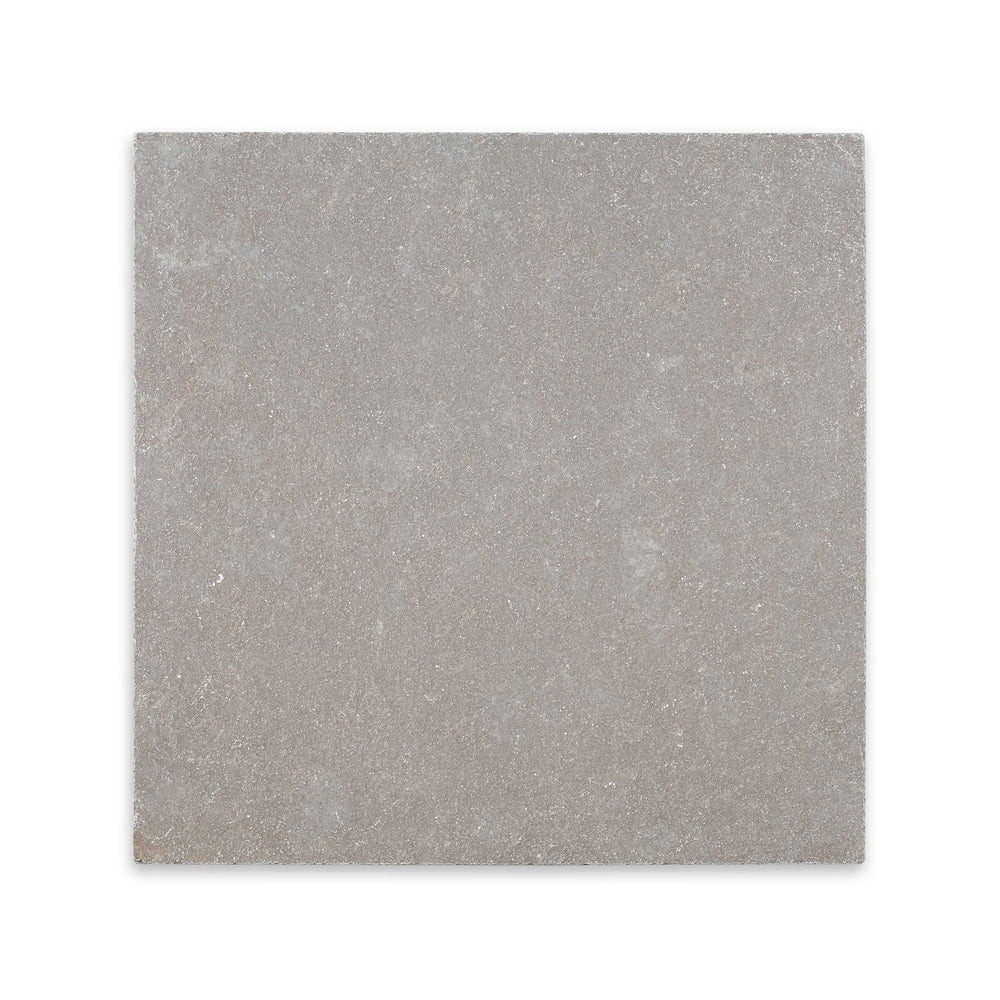 Overhead view of Limestone Purbeck Grey 24x24 distressed paver, featuring square format with a rugged texture and rustic, earthy appeal.