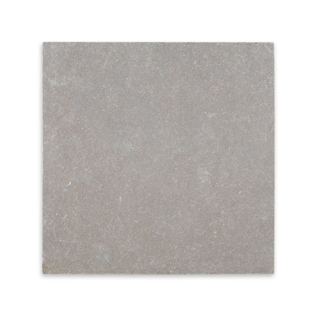 Overhead view of Limestone Purbeck Grey 24x24 distressed paver, featuring square format with a rugged texture and rustic, earthy appeal.