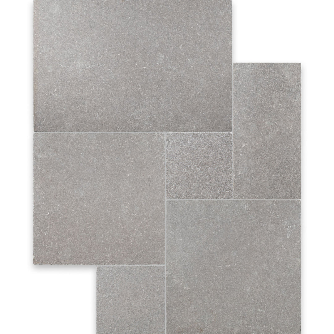 Overview of Limestone Purbeck Grey Versailles Pattern Distressed Paver with multi-size stone layout and a timeworn, historic appearance.