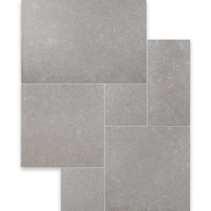 Overview of Limestone Purbeck Grey Versailles Pattern Distressed Paver with multi-size stone layout and a timeworn, historic appearance.