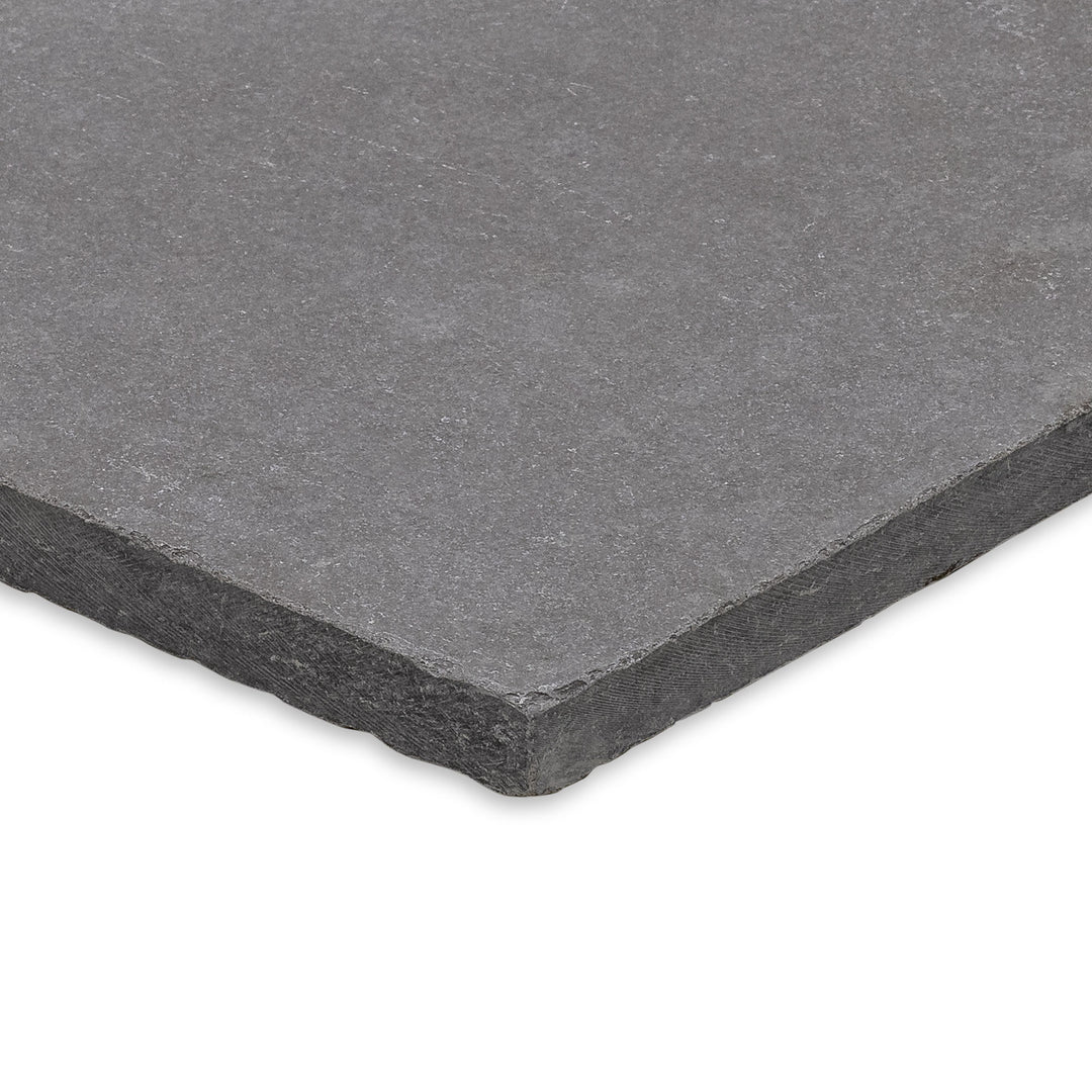 Angled shot of Limestone Purbeck Grey Versailles Pattern Distressed Paver, featuring a multi-size layout and aged finish perfect for classic stonework landscapes.