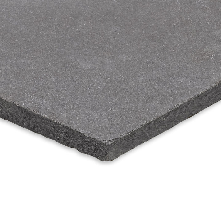 Angled shot of Limestone Purbeck Grey Versailles Pattern Distressed Paver, featuring a multi-size layout and aged finish perfect for classic stonework landscapes.