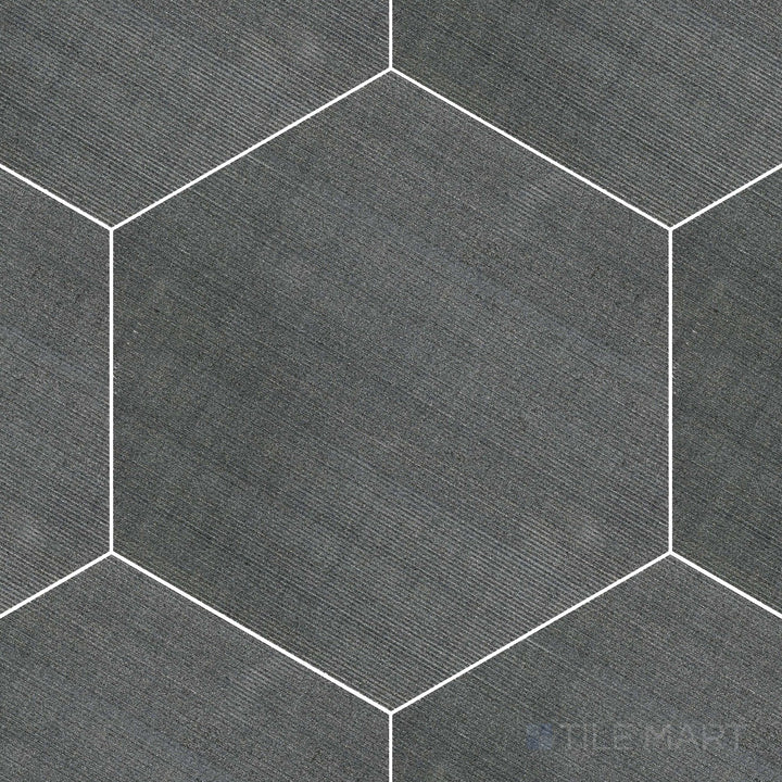 Basalt Black 10" hexagon flow tile displayed in overview, featuring dark volcanic stone in a bold hexagonal shape with natural movement.