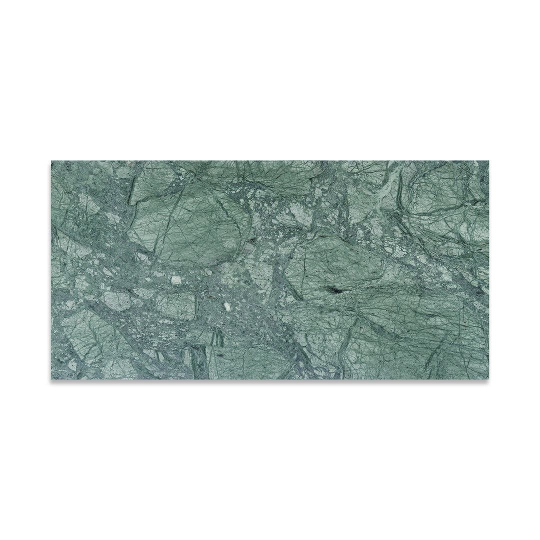 Overhead image of Empress Green Marble 12x24 tile in honed finish, featuring rich green hues with flowing white veining and a soft matte surface.